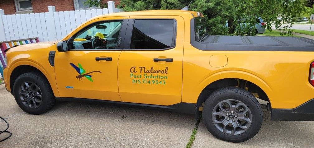 A Natural Pest Solution's branded yellow truck